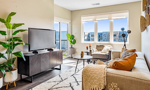 a living room with a couch and a tv